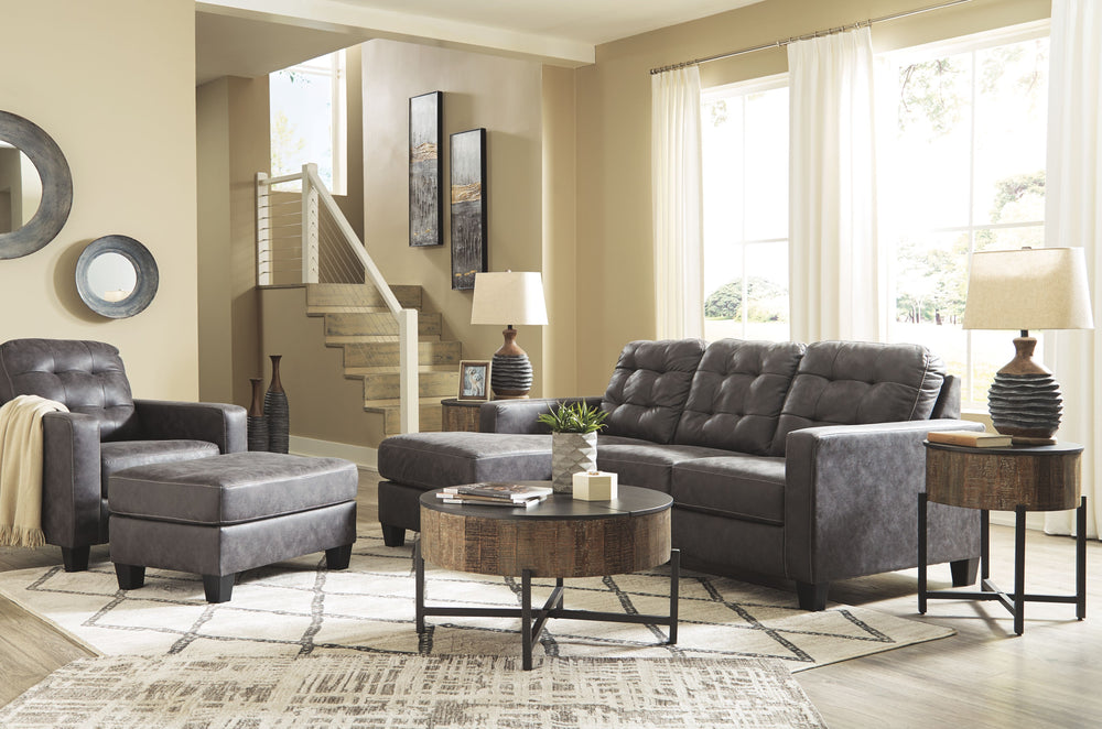 This ultra-contemporary set invites you to spread out and make yourself comfortable. Linear track arms offer a clean, sleek aesthetic, while tufted box cushions are a nod to mid-century design. Rest assured, a movable ottoman and reversible seat cushions 