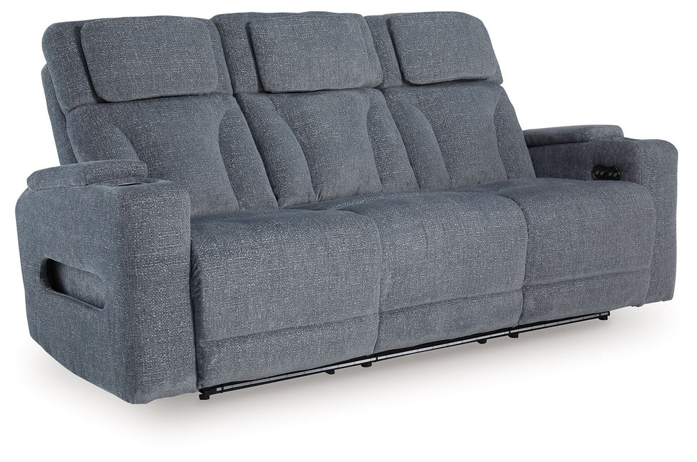 Chill-out time has never looked better. This power reclining sofa-'s adjustable headrest ensures a perfect view of the TV no matter how far back you recline, while the extended ottoman takes your comfort to the next level. A drop-down table is decked out 