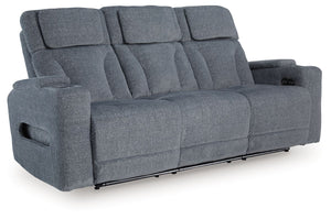 Chill-out time has never looked better. This power reclining sofa-'s adjustable headrest ensures a perfect view of the TV no matter how far back you recline, while the extended ottoman takes your comfort to the next level. A drop-down table is decked out 