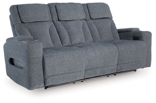 Chill-out time has never looked better. This power reclining sofa-'s adjustable headrest ensures a perfect view of the TV no matter how far back you recline, while the extended ottoman takes your comfort to the next level. A drop-down table is decked out 
