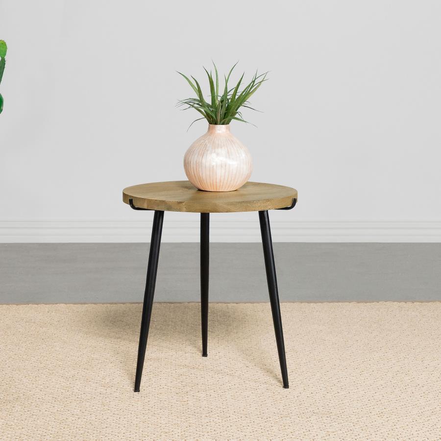 This round end table blends natural beauty with mid-century-inspired design. The solid mango wood top in a natural finish highlights its organic texture and grain patterns, adding earthy appeal. Supported by black powder-coated iron legs, the tapered and 