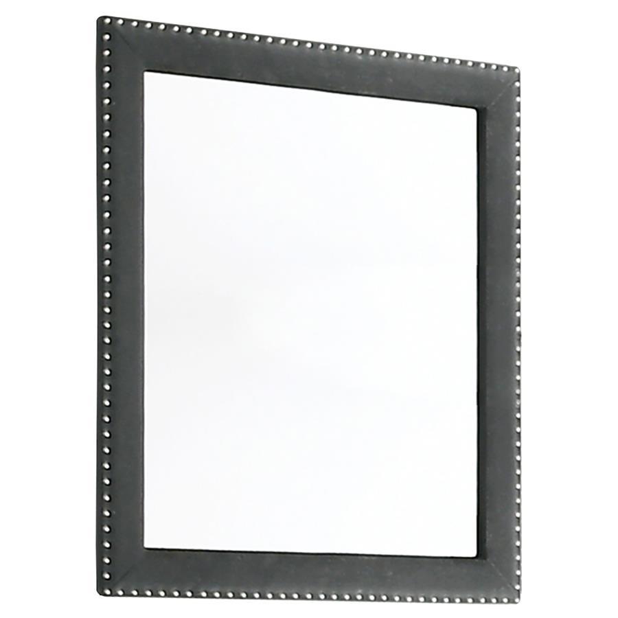 This gorgeous mirror is a masterpiece made for royalty, ready to perk up your sleeping space. Its admirable frame is upholstered entirely in gorgeous velvet fabric. Nail head trim surrounds the frame for a sleek and exquisite upgrade. Place this mirror on