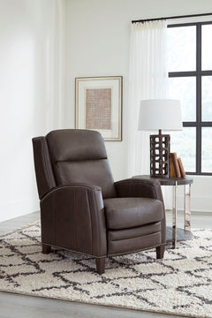 The Vermont power recliner offers a luxurious and effortless power pushback recline feature, allowing you to easily find the most comfortable position for relaxation. It is upholstered in soft leather with custom matching and features decorative nail head