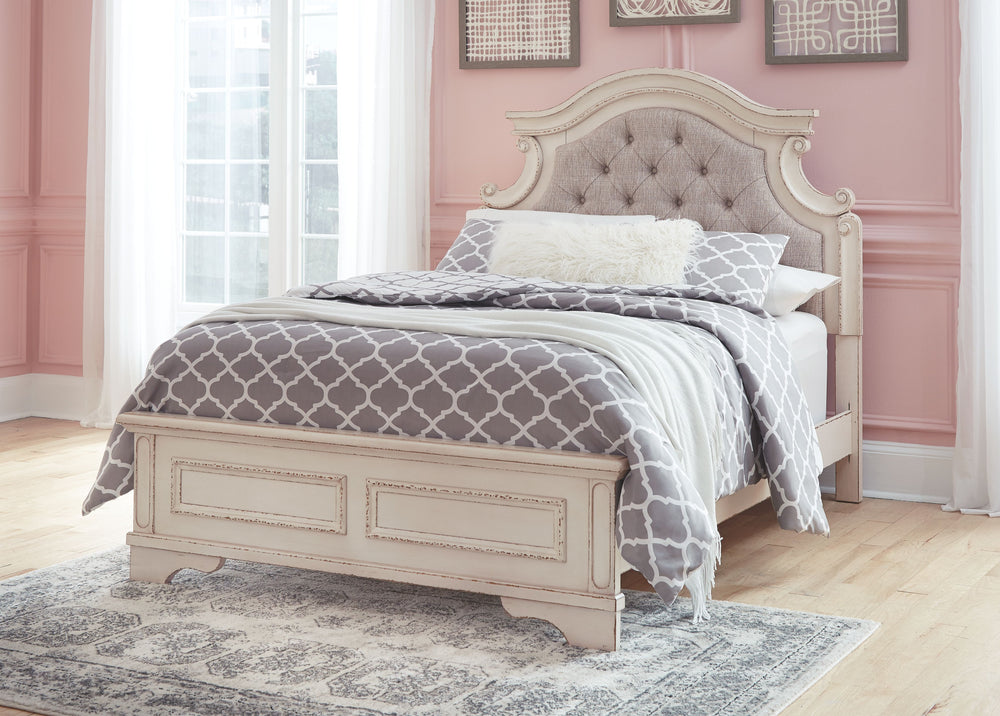 Elevating the art of traditional cottage styling, this full upholstered bed is your dream bedroom retreat realized. A curvaceous beauty, this brilliant upholstered bed wows with dramatic scalloped details and fanciful trim work. The distressed chipped whi