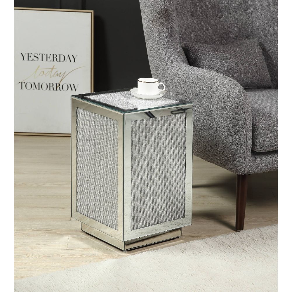 Liven up your empty living room with the Lavina occasional table. This table offers a mirrored design with faux diamond inlay. The structure built from composite wood and mirrored panels covering every surface. A glam display table that naturally attracts