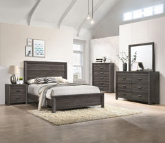 This bedroom set is the embodiment of understated sophistication, featuring a muted gray finish that complements its clean and contemporary design. The robust bed frame anchors the room with a sense of sturdiness and style. Accompanying the bed are coordi
