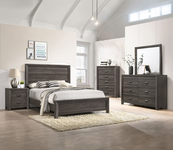 This bedroom set is the embodiment of understated sophistication, featuring a muted gray finish that complements its clean and contemporary design. The robust bed frame anchors the room with a sense of sturdiness and style. Accompanying the bed are coordi
