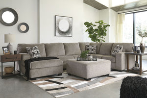 A mastery in less is more, this living room set manages to make cool, contemporary design so warm and cozy. A new twist on neutral, the sectionalâ€™s soothing â€œplatinumâ€ tone upholstery is incredibly plush to the touch. Gently rounded corners give the