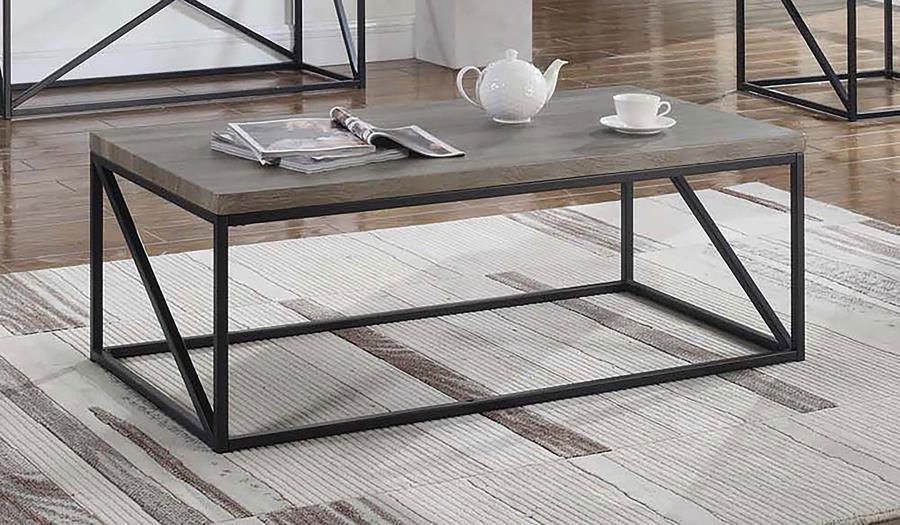 Add modern appeal to your living room with this stylish coffee table. The engineered wood top with a scratch-resistant laminate veneer in a sonoma grey finish provides a wood-like texture with lasting durability. Its black powder-coated metal frame enhanc