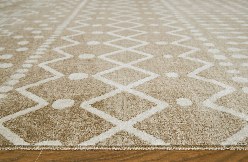 Inspired by ancient tribal patterns, this area rug showcases an eclectic mix of unique motifs in neutral hues. Its low pile height makes it ideal for high-traffic spaces. This area rug is machine washable for fuss-free cleaning.<br/><br/><b>Product Featur