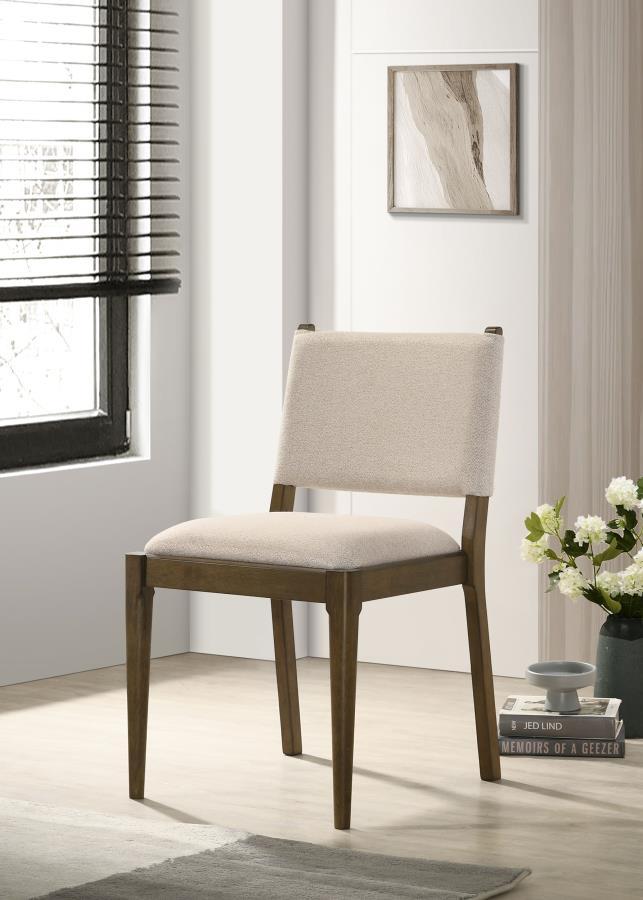 This stylish dining chair merges modern design with elegant craftsmanship. Featuring a wrapped backrest accented by unique brown tie detailing on the back, it adds a sophisticated touch to your dining space. Upholstered in soft light tan fabric, the chair