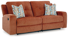 This reclining sofa invites you to a luxuriously soft lounging experience. The chic hue fits right in with contemporary color palettes. A tufted back keeps the look right on trend. Balancing style and function, its pull tab reclining effortlessly takes yo