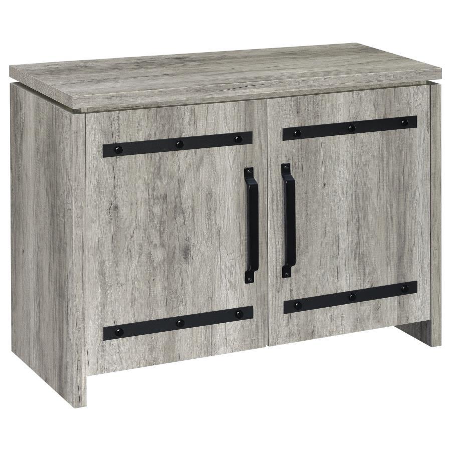 This storage cabinet features a clean-lined silhouette with industrial-inspired hardware for a functional, modern-rustic look. Crafted from engineered wood with a scratch-resistant and eco-friendly laminate veneer, it showcases a grey driftwood finish tha