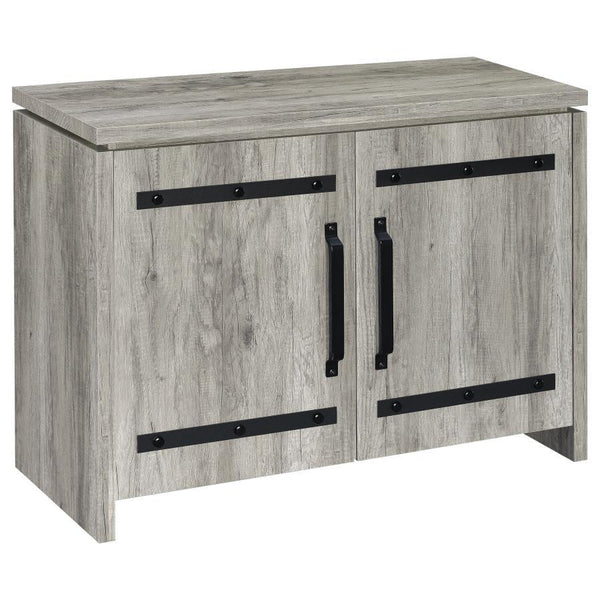 This storage cabinet features a clean-lined silhouette with industrial-inspired hardware for a functional, modern-rustic look. Crafted from engineered wood with a scratch-resistant and eco-friendly laminate veneer, it showcases a grey driftwood finish tha