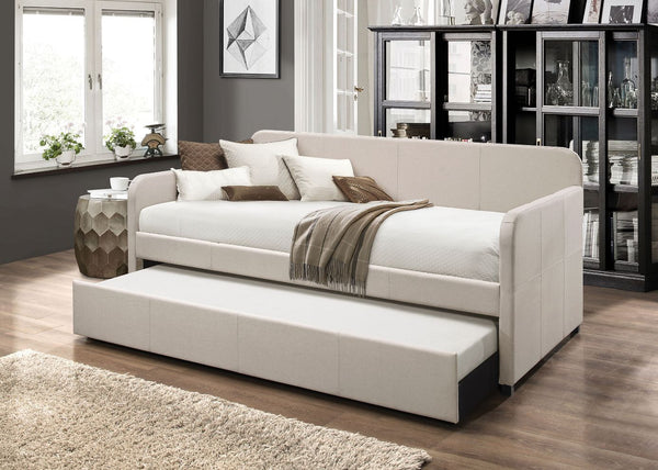 A functional, contemporary upgrade on a traditional staple, the stylish Jagger daybed and trundle is an excellent addition to any living room, guest room, or home office. Made with a sturdy wood frame, this piece features a panel back and track panel arms
