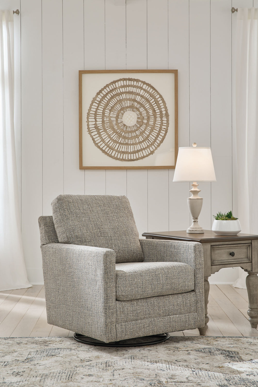 Timeless design for the here and now. This swivel glider accent chair pays homage to traditional styling, concluding in sleek track arms. Its crisp, clean character radiates charm. An alchemy of old and new aesthetics, this chair smartly appeals to your l