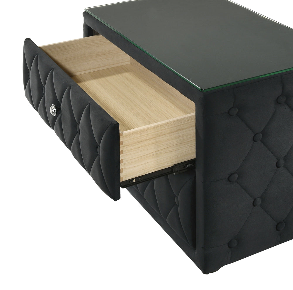 This stunning nightstand exudes modern sophistication with its luxurious velvet upholstery and elegant diamond-tufted design. The two spacious drawers provide ample storage, while the crystal-like drawer pulls add a touch of glamour. The sleek glass top e