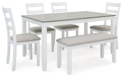 Feast your eyes on how beautiful simplicity can be. This dining set creates a cohesive, modern farmhouse feel with its clean-lined profile and chic two-tone color scheme. Its upholstered ladderback chairs are such a classic, while the addition of a comfor