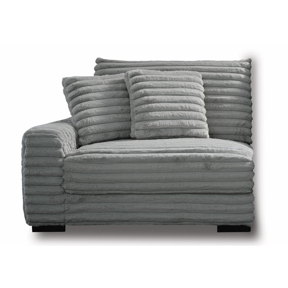 The Embrace Left Arm Facing Chair with 2 Accent Pillows in gray is a sophisticated and comfortable addition to your sectional arrangement. Featuring 100% gray polyester fabric with a fluffy, blanket-like texture, this chair promises ultimate relaxation. I