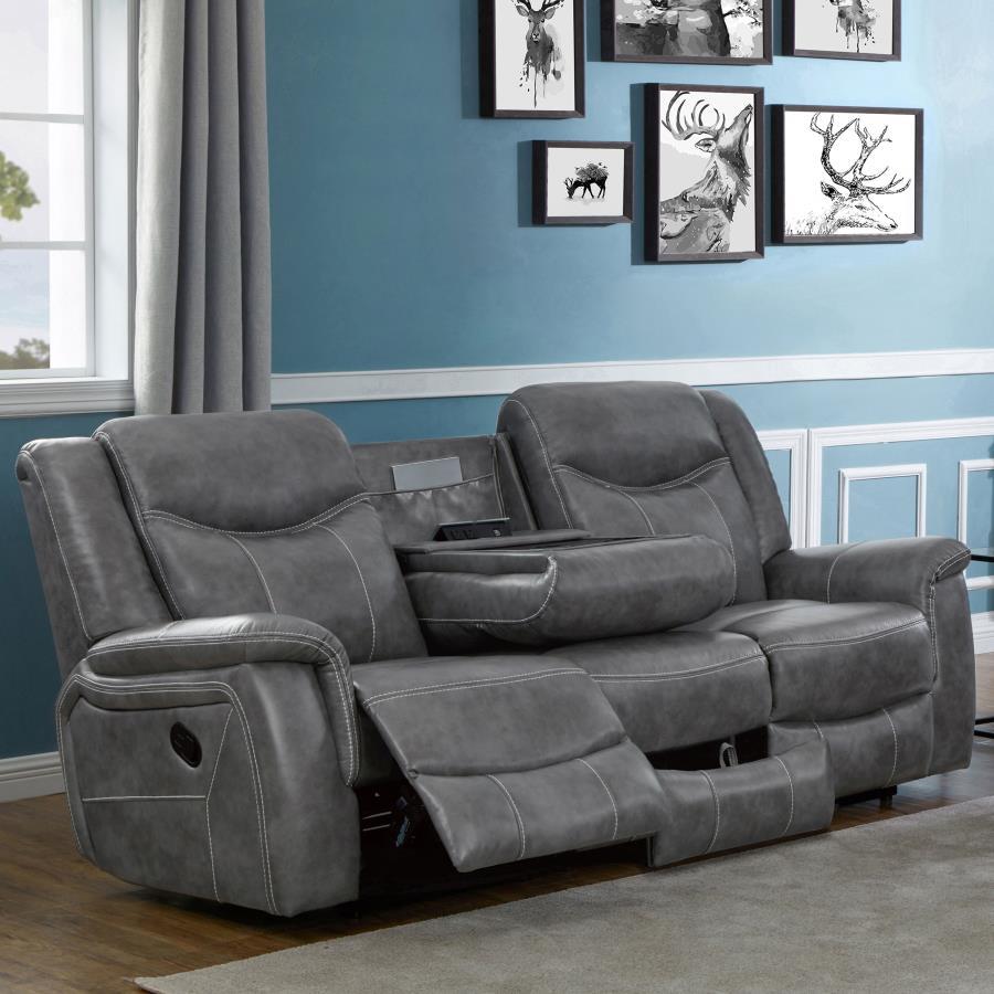 Grey is the trendy color these days and it doesn-'t look any better than on this opulent motion sofa. It features angled seat backs with extra padded headrests for ultimate luxury. Armrests and even the leg rest on the recliner are padded for extra comfor