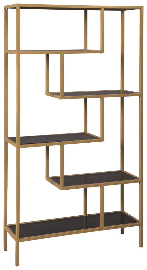 Simple structures make for the coolest designs. This bookcase builds on its architectural bias with offset shelves to create a dynamic display in your space. With goldtone finished metal and gray tinted glass, this piece creates a sophisticated and modern