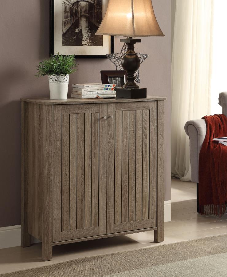This shoe cabinet combines functionality with clean, contemporary design, featuring a slatted door front and a dark taupe finish. Crafted from engineered wood with a scratch-resistant and eco-friendly laminate veneer, it offers four tiers of interior shel