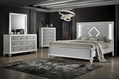 Indulge in the opulent allure of the Stardust 4 Piece Bedroom Set in White, a pinnacle of modern luxury for your bedroom ensemble. The set, which includes a Bed, Dresser, Mirror and Chest, is crafted with meticulous attention to detail, each piece boasts 
