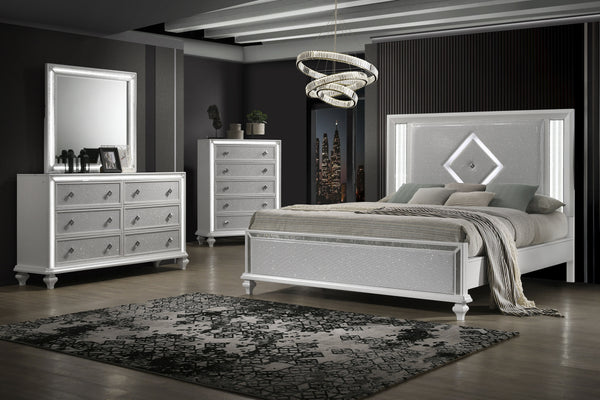 Indulge in the opulent allure of the Stardust 4 Piece Bedroom Set in White, a pinnacle of modern luxury for your bedroom ensemble. The set, which includes a Bed, Dresser, Mirror and Chest, is crafted with meticulous attention to detail, each piece boasts 