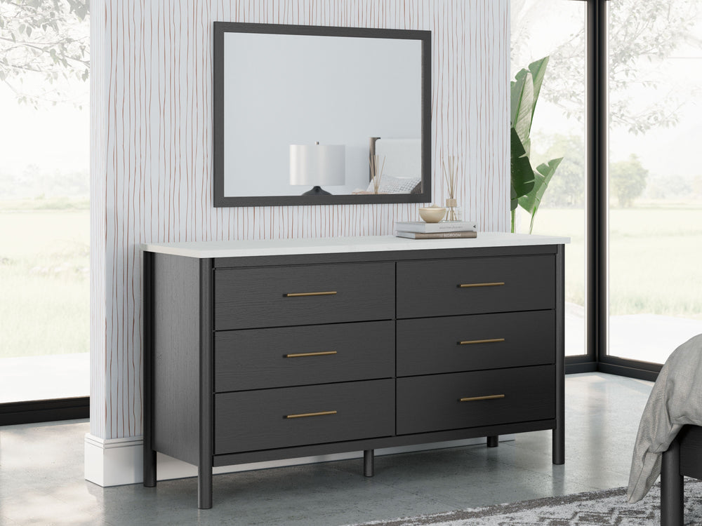This dresser and mirror set reflects your sophisticated approach to boho style. Crafted with both form and function in mind, its replicated marble top beautifully contrasts a matte black finish. The versatile design suits all-neutral spaces or blends with