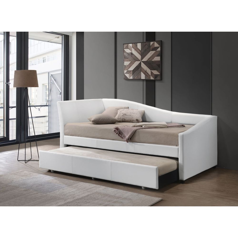 The Jedda daybed in white faux leather is excellent for a sitting room or guest bedroom. It will add a stylish look with features like a sloped frame, square wooden legs, and trundle for guests. This piece is simple and versatile enough to suit any space.