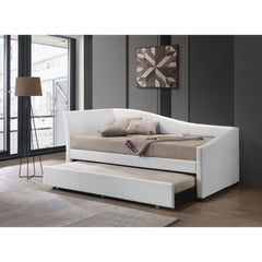 The Jedda daybed in white faux leather is excellent for a sitting room or guest bedroom. It will add a stylish look with features like a sloped frame, square wooden legs, and trundle for guests. This piece is simple and versatile enough to suit any space.