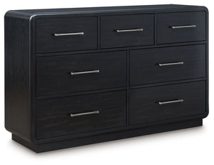 Inspired by art deco design, this softly shaped dresser makes a lasting impression in a simply stunning way. Its magnificent curved silhouette is enhanced by a rich layered black finish on the textured wood grain surface. This is the statement piece youâ€