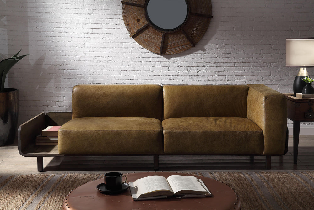The unique asymmetrical design of the Blanca and its top grain leather makes it the perfect focal point in a modern living room. The wooden base that wraps around the base of the tight seat cushion is supported by straight legs, and provides an extra side