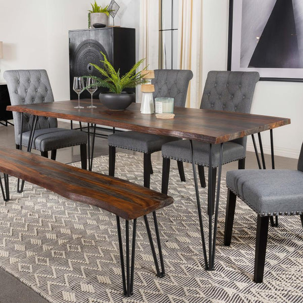  designed with a spacious sheesham wood tabletop in a grey finish and natural live-edge details. Retro-inspired hairpin metal legs in a bold gunmetal finish lend an industrial touc