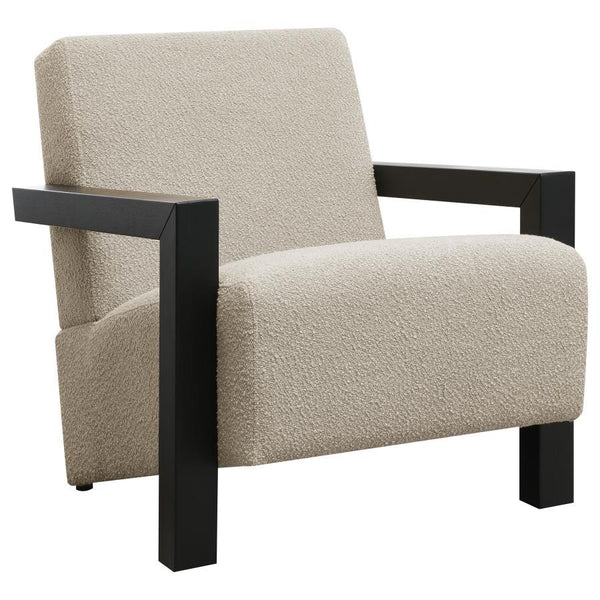 Exposed wood armrests add a sense of precision and structure to a modern accent armchair. It-'s a fresh, refined look with a neutral palette and minimalist allure. A slightly reclined seat and back create an inviting silhouette for the chair, which blends