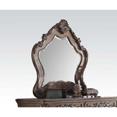 The Ragenardus mirror is an impeccable example of truly memorable luxurious traditional design. This vintage oak mirror features an arched frame with intricate floral design and beveled mirror. This piece is sure to bring a classy and traditional style to