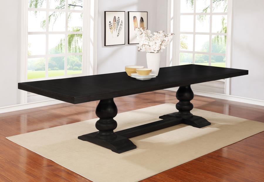 Celebrate a curvy, dramatic silhouette that adds an artful elegance to a formal space. This formal dining table offers a lush antique noir finish wood construction with a polished aesthetic. Its trestle-style base reflects sensual tapering and supports be