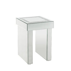 Go full glam with this Noralie End Table. The beautiful mirrored finish and glistening faux diamonds inlay will reflect light and make any room appear larger. It provides a spacious table top ample enough for displaying various decor items while the sled 