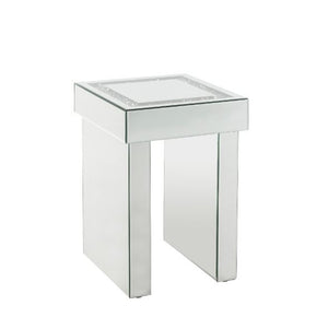 Go full glam with this Noralie End Table. The beautiful mirrored finish and glistening faux diamonds inlay will reflect light and make any room appear larger. It provides a spacious table top ample enough for displaying various decor items while the sled 