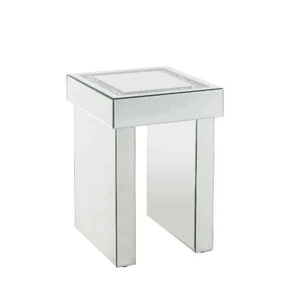 Go full glam with this Noralie End Table. The beautiful mirrored finish and glistening faux diamonds inlay will reflect light and make any room appear larger. It provides a spacious table top ample enough for displaying various decor items while the sled 