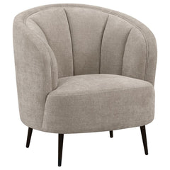 Show off your curve appeal with a modern upholstered accent chair, a great piece to float in the center of a room for an attractive focal point. The soft beige upholstery, with its velvety texture and extra wide channel details frame, creates a refined bu