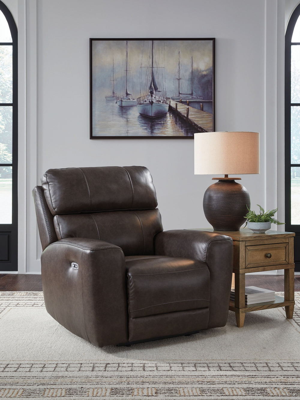 Versatile style teams up with everyday convenience to create this power recliner. Settle into the sleek leather seating area and effortlessly recline with one-touch controls. With the addition of USB charging, you can keep go-to devices close as you loung
