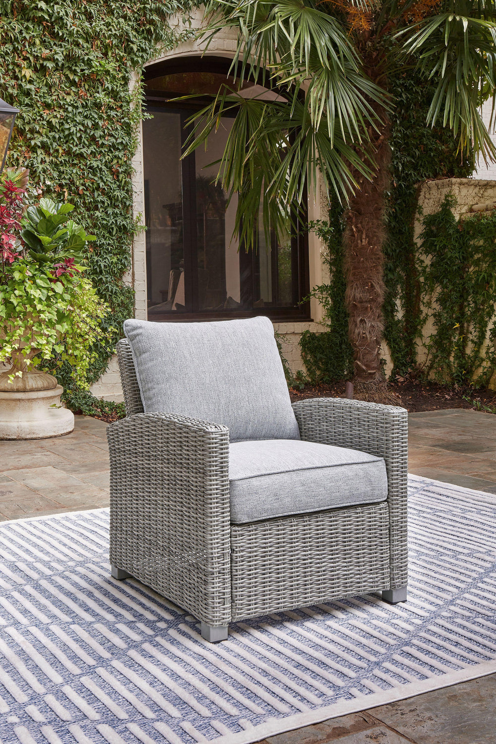 Indulge in backyard bliss. This outdoor lounge chair has a straightforward sense of style with its light gray resin wicker and wood-look finish. Gray high-performance Nuvella+â„¢ fabric covers the cushioned seat and back, weathering the elements and keepi