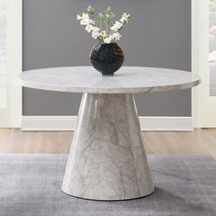 The Kacey dining set, with its elegant round wooden table top, exudes charm and sophistication. The marble grain finish adds a touch of luxury, while the single pedestal base ensures stability. Complemented by padded seat and back cushion side chairs, thi