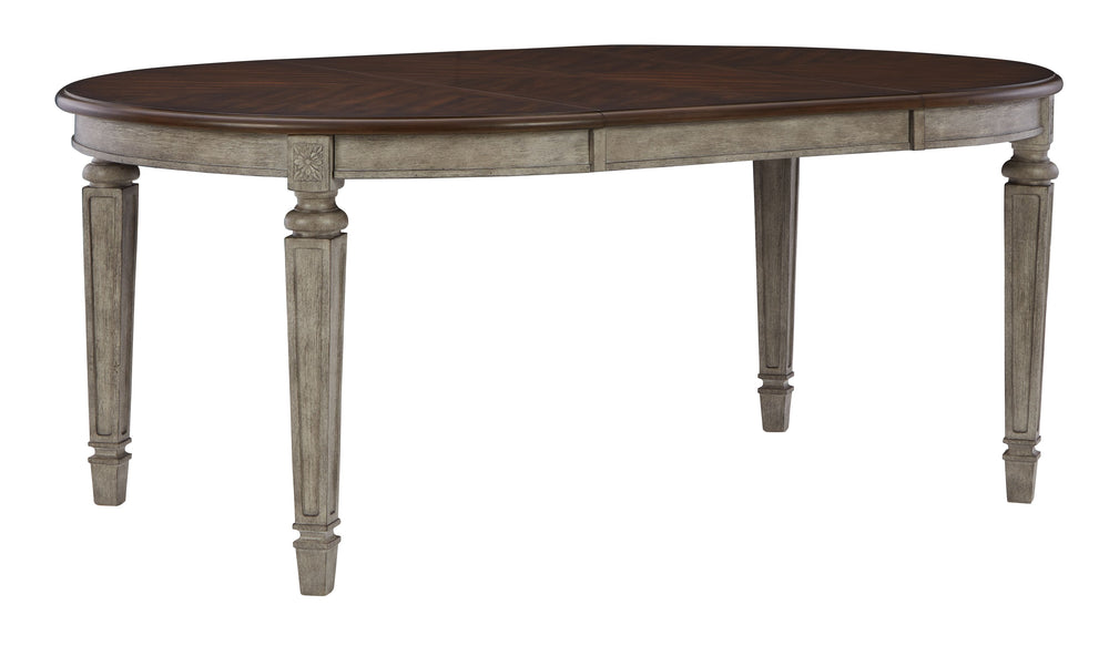 This dining room group adds understated beauty to any dining space with its traditional cottage design. Its outstanding two-tone finish features an antiqued gray body with a rich deep walnut brown top. This ample round table includes one extension leaf to
