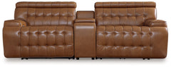 A mid-century modern update to a retro classic, this sectional is generously adaptable. Its combination of skillfully matched leather and faux leather upholstery exudes luxury and elegance. Deep seat cushions with dramatic tufting beckon you to relax and 