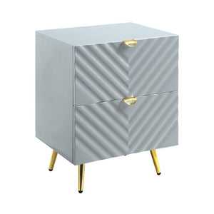 The Gaines Collection is a glamorous and sophisticated grouping that adds a chic style to any room. The gray gloss finish and gold metal accents help to accentuate the clean lines of the pieces and add a pop of glamour. The diagonal line design adds visua