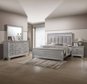 This elegant bedroom suite combines timeless design with contemporary appeal. The soft gray finish offers a modern twist on classic styling, with integrated LED lighting on the tufted headboard adding a luxurious focal point. The collection includes a bed