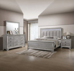 This elegant bedroom suite combines timeless design with contemporary appeal. The soft gray finish offers a modern twist on classic styling, with integrated LED lighting on the tufted headboard adding a luxurious focal point. The collection includes a bed
