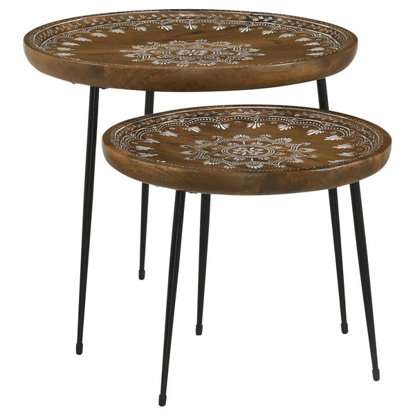 Infuse your space with bohemian charm using this two-piece nesting table set, featuring hand-painted floral motifs on eco-friendly solid mango wood tops. The tray-like round surfaces have softly raised edges, adding both style and function. Supported by s